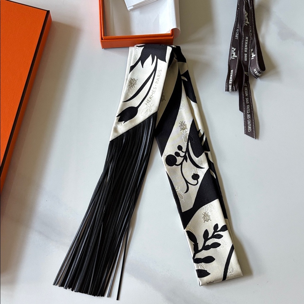 Brand new Hermes fringe Twilly leather black noir